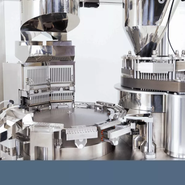 A close-up shot of the FACF fully automatic capsule filler from LFA Machines.